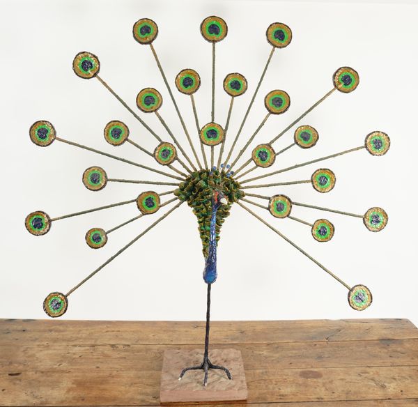 A POLYCHROME DECORATED PAPIER MACHE AND WIREWORK PEACOCK SCULPTURE