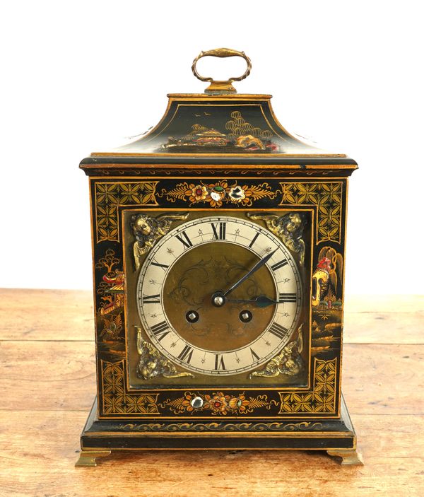 A BLACK LACQUERED JAPANNED MANTEL CLOCK