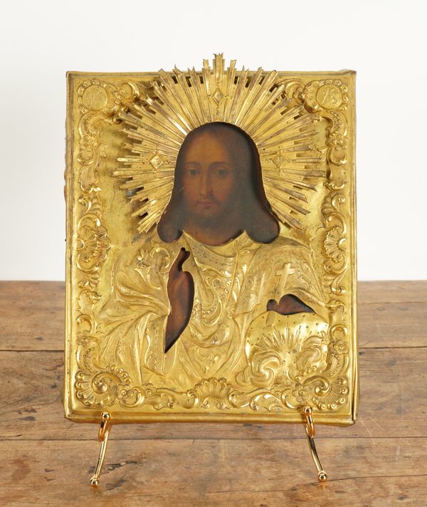 A RUSSIAN ICON OF CHRIST WITH GILT-METAL REPOUSSE OKLAD