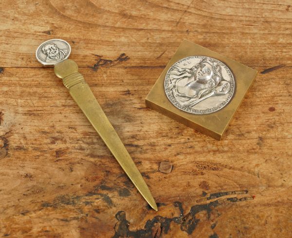 A SILVER PARCEL-GILT LETTER OPENER AND A PAPERWEIGHT (2)