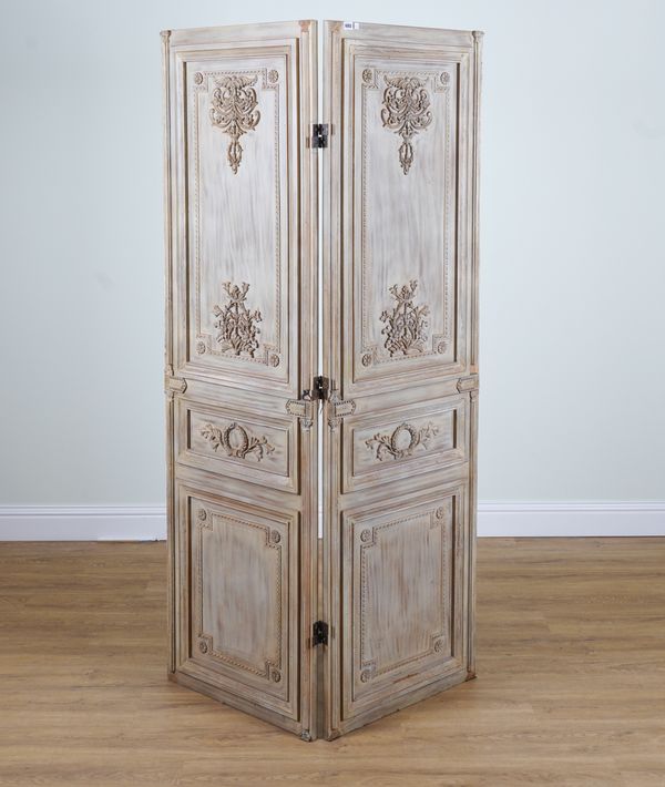 A NEO-CLASSICAL REVIVAL CARVED AND WHITEWASHED TWO FOLD DRAFT SCREEN