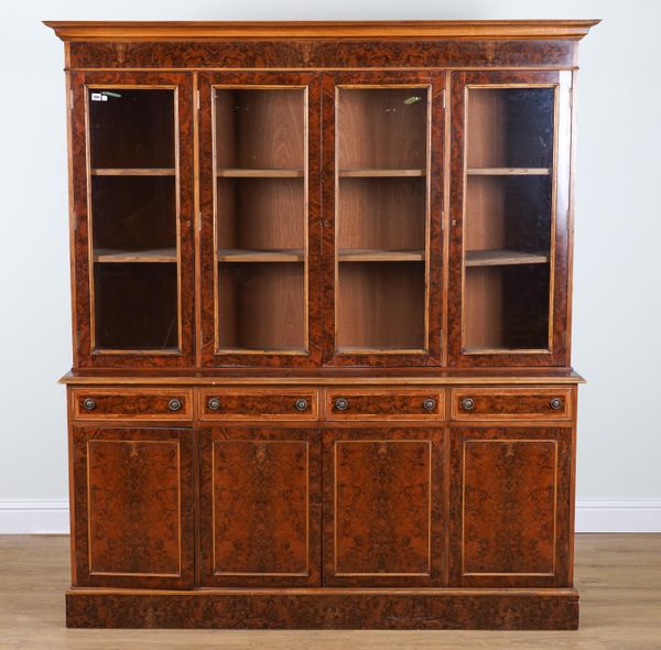 A GEORGE III STYLE FIGURED WALNUT FOUR DOOR BOOKCASE CABINET