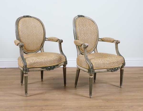 A PAIR OF LOUIS XVI STYLE POLYCHROME PAINTED OPEN ARMCHAIRS  (2)