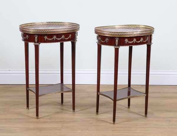 A PAIR OF FRENCH GILT METAL MOUNTED MARBLE TOPPED OVAL TWO TIER SIDE TABLES  (2)