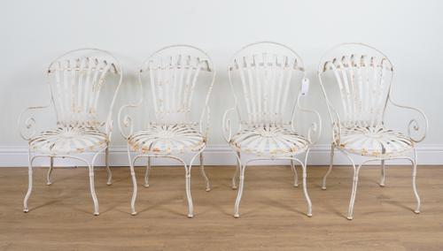 A SET OF FOUR WHITE PAINTED METAL GARDEN OPEN ARMCHAIRS (4)
