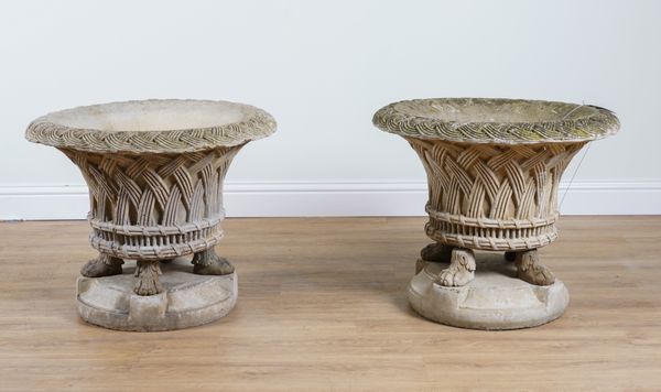 A PAIR OF RECONSTITUTED STONE LATTICE DECORATED GARDEN URNS (2)