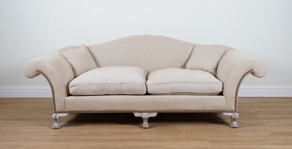 A CREAM UPHOLSTERED HUMPBACK SOFA