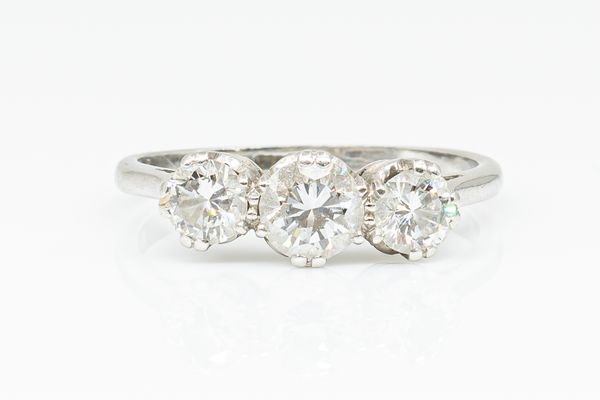 A 1.05 CARAT DIAMOND THREE STONE RING