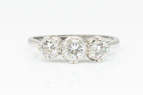 A 1.05 CARAT DIAMOND THREE STONE RING