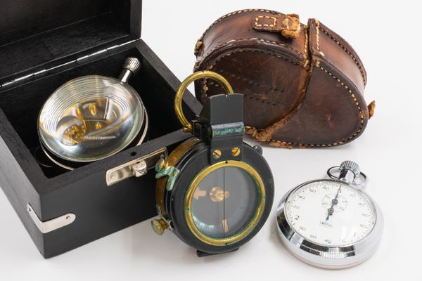 A PAPERWEIGHT CLOCK, A SMITHS STOP WATCH AND A 1937 FIELD COMPASS (3)