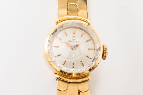 AN OMEGA GOLD WATCH