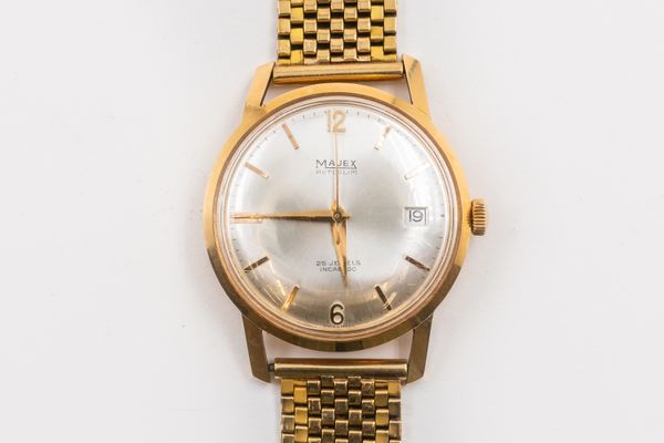 A MAJEX GOLD WATCH AND THREE OTHER WATCHES (4)