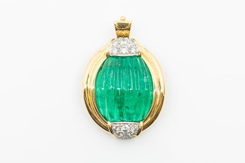 AN EMERALD AND DIAMOND PENDANT