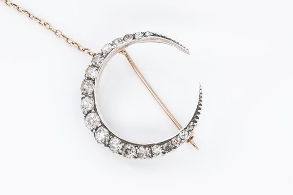 A VICTORIAN DIAMOND CRESCENT BROOCH