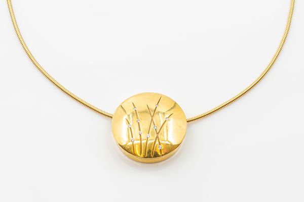 A MODERN DIAMOND SET GOLD PENDANT