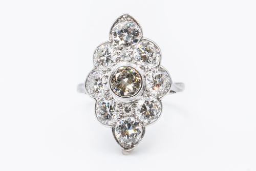 A NAVETTE SHAPED DIAMOND CLUSTER RING