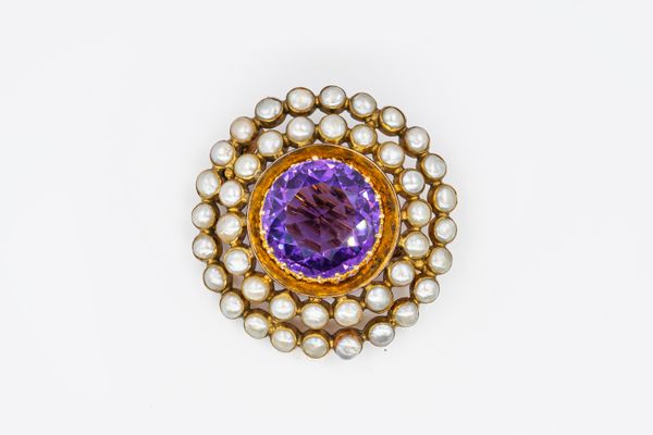 AN EDWARDIAN AMETHYST AND PEARL BROOCH