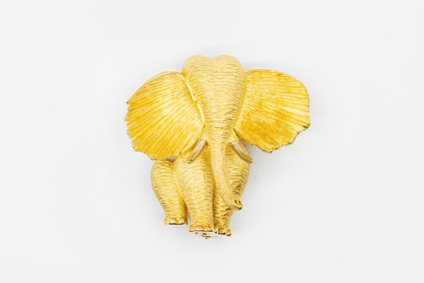 A DUNAY GOLD ELEPHANT CLIP BROOCH