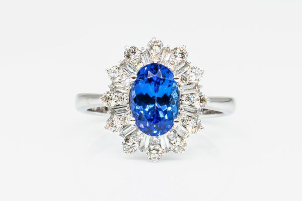 A TANZANITE AND DIAMOND CLUSTER RING