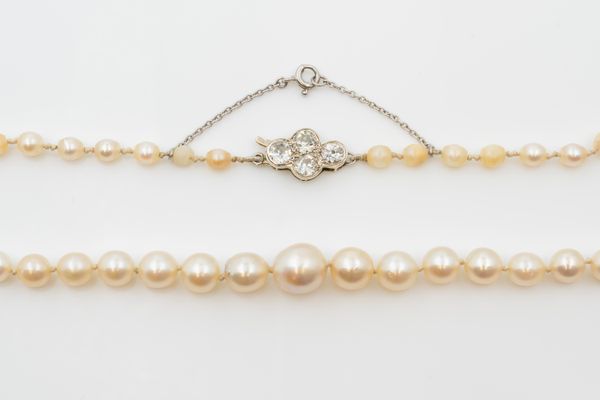 A SINGLE ROW OF GRADUATED CULTURED PEARLS WITH A DIAMOND CLASP