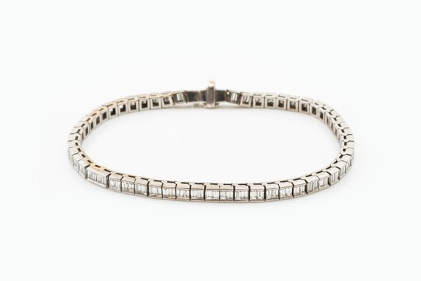 A 5.74 CARAT DIAMOND TENNIS BRACELET