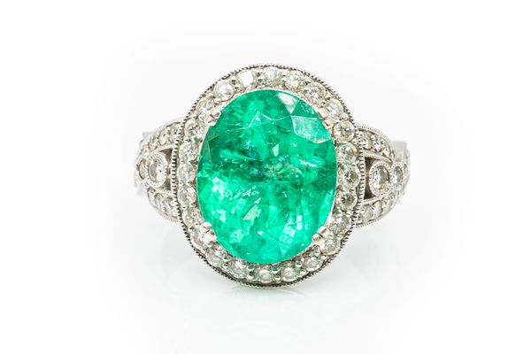 A LARGE EMERALD AND DIAMOND DRESS RING