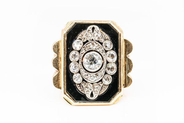 A LARGE DIAMOND SET SIGNET RING