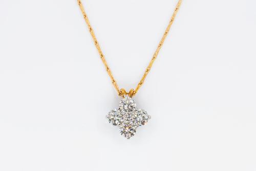 A DIAMOND PENDANT AND CHAIN