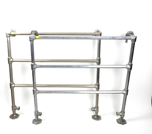 A PAIR OF EARLY 20TH CENTURY CHROME DECO HEATED TOWEL RAILS