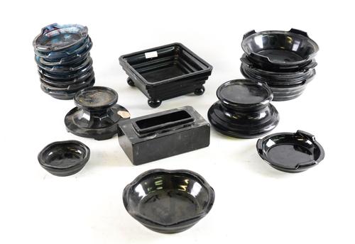 A LARGE GROUP OF EARLY TO MID 20TH CENTURY BLACK GLASS STANDS
