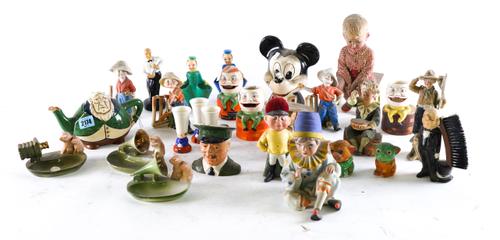 A LARGE GROUP OF EARLY TO MID CENTURY NOVELTY CERAMICS INCLUDING MONEY BOXES, EGG CUPS, FIGURES AND SUNDRY