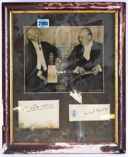 A BLACK AND WHITE PHOTO OF WINSTON CHURCHILL AND DAVID LLOYD GEORGE