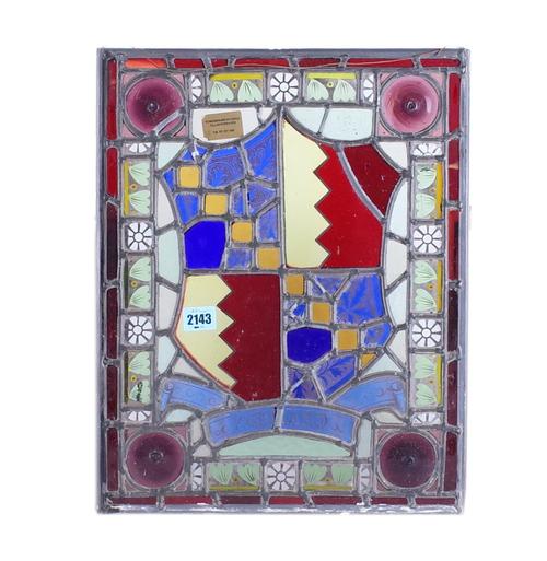 AN EARLY 20TH CENTURY STAINED GLASS PANEL WITH  SHIELD CREST