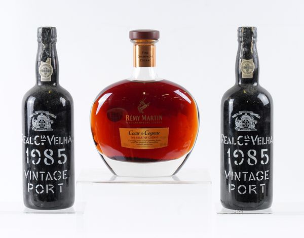 TWO BOTTLES OF REAL COMPANHIA VELHA VINTAGE 1985 PORT AND A BOTTLE OF REMY MARTIN COGNAC (3)