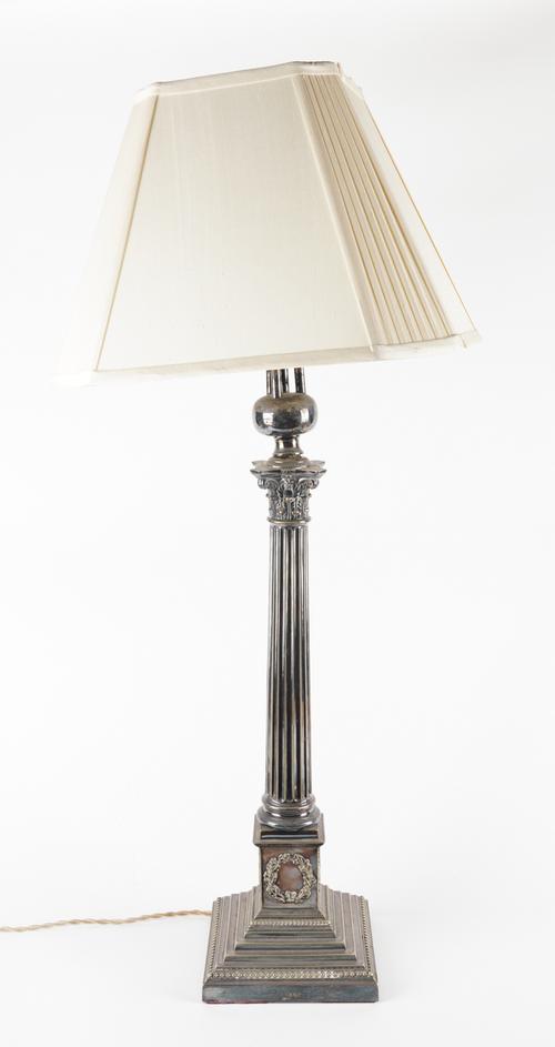 A CORINTHIAN COLUMN SILVER-PLATED THREE LIGHT TABLE LAMP