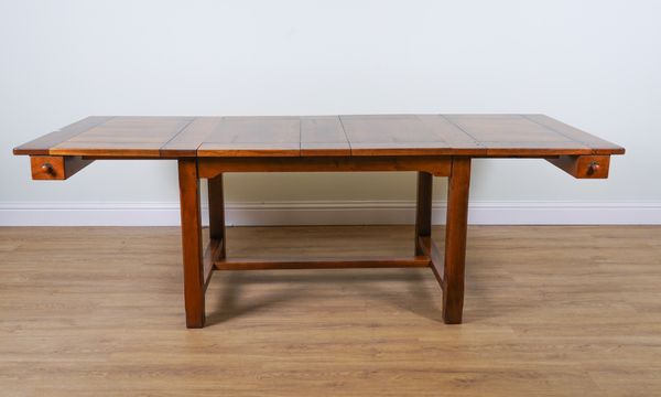 A MODERN OAK EXTENDING DINING TABLE (9)