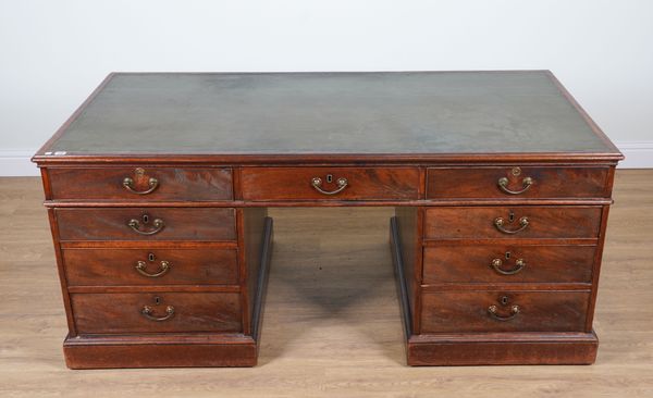 A GEORGE III AND LATER MAHOGANY PARTNERS’ DESK