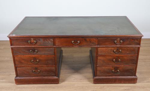 A GEORGE III AND LATER MAHOGANY PARTNERS’ DESK