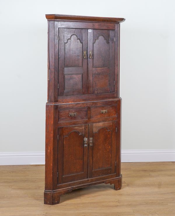 A LATE 18TH CENTURY OAK DOUBLE HEIGHT CORNER CABINET