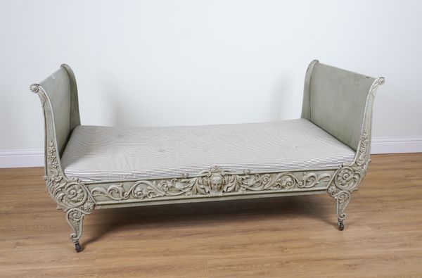 A VICTORIAN GREEN PAINTED CAST IRON DAY BED