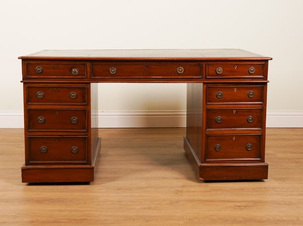 A VICTORIAN MAHOGANY NINE DRAWER PEDESTAL DESK