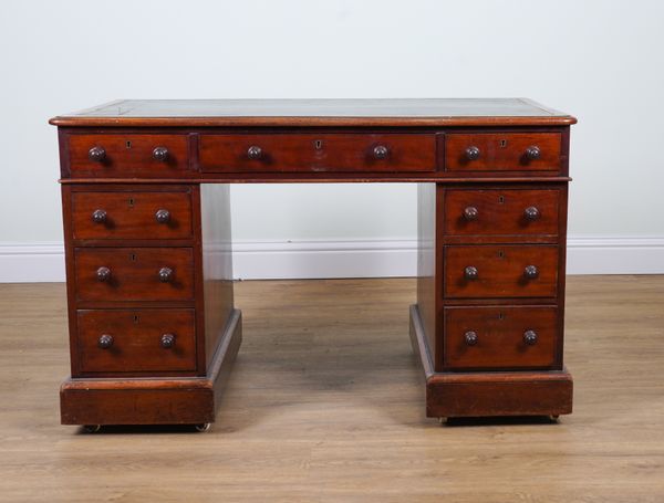 A VICTORIAN MAHOGANY NINE DRAWER PEDESTAL DESK