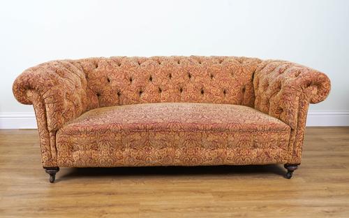 A VICTORIAN MAHOGANY FRAMED CHESTERFIELD SOFA