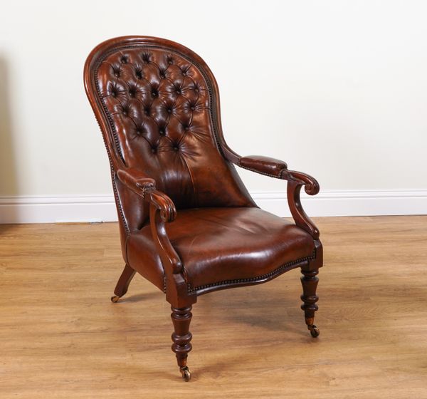 A VICTORIAN MAHOGANY FRAMED LEATHER UPHOLSTERED  SPOONBACK OPEN ARMCHAIR