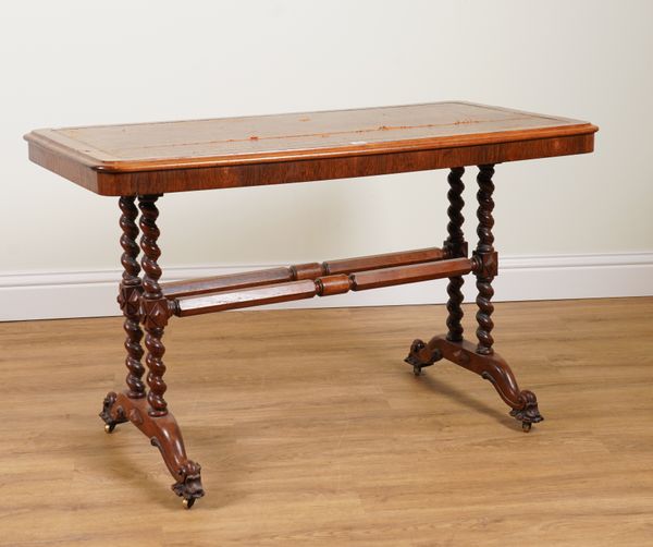 A VICTORIAN WALNUT WRITING TABLE