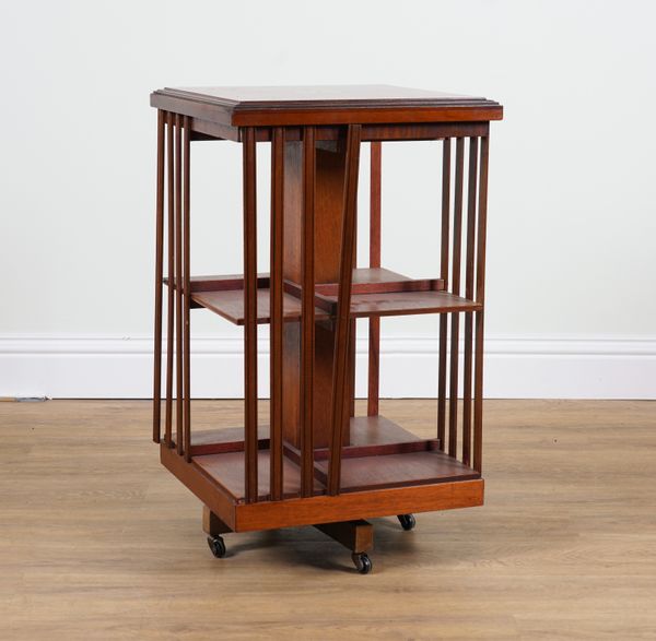 AN EDWARDIAN INLAID MAHOGANY REVOLVING BOOKCASE