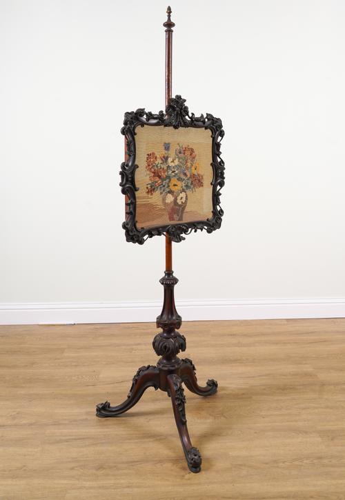 AN EARLY VICTORIAN MAHOGANY POLE SCREEN