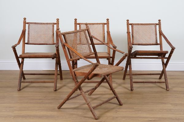 A SET OF FOUR BAMBOO AND CANE WORK FOLDING ARMCHAIRS (4)