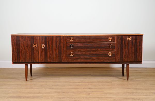 SCHREIBER; A MID-20TH CENTURY FAUX ROSEWOOD LOW SIDEBOARD