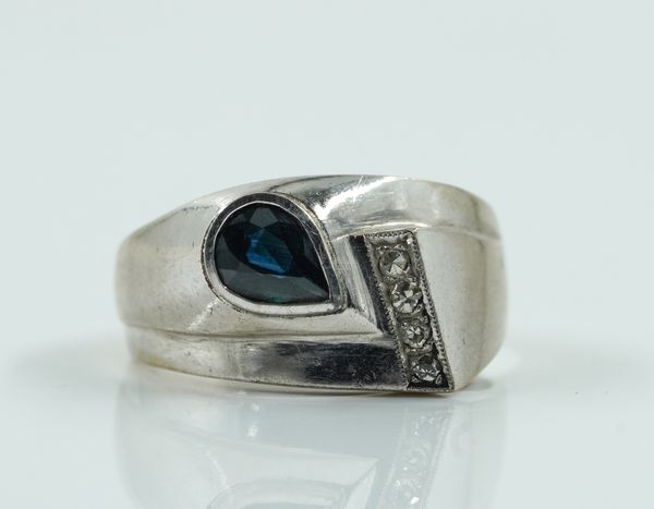 A SAPPHIRE AND DIAMOND ABSTRACT RING